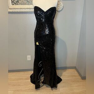 Long black fully sequined dress with thigh slit